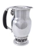 ϒ Georg Jensen, a Danish silver Grape pattern pitcher or jug