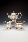 ϒ A George IV silver three piece tea service by Paul Storr