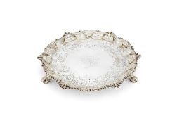 A late George II silver shaped circular salver