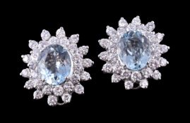 A pair of aquamarine and diamond cluster earrings