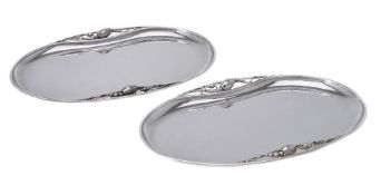 Georg Jensen, a pair of Danish silver Blossom pattern trays