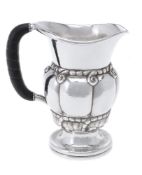 ϒ Georg Jensen, a Danish silver water jug or pitcher