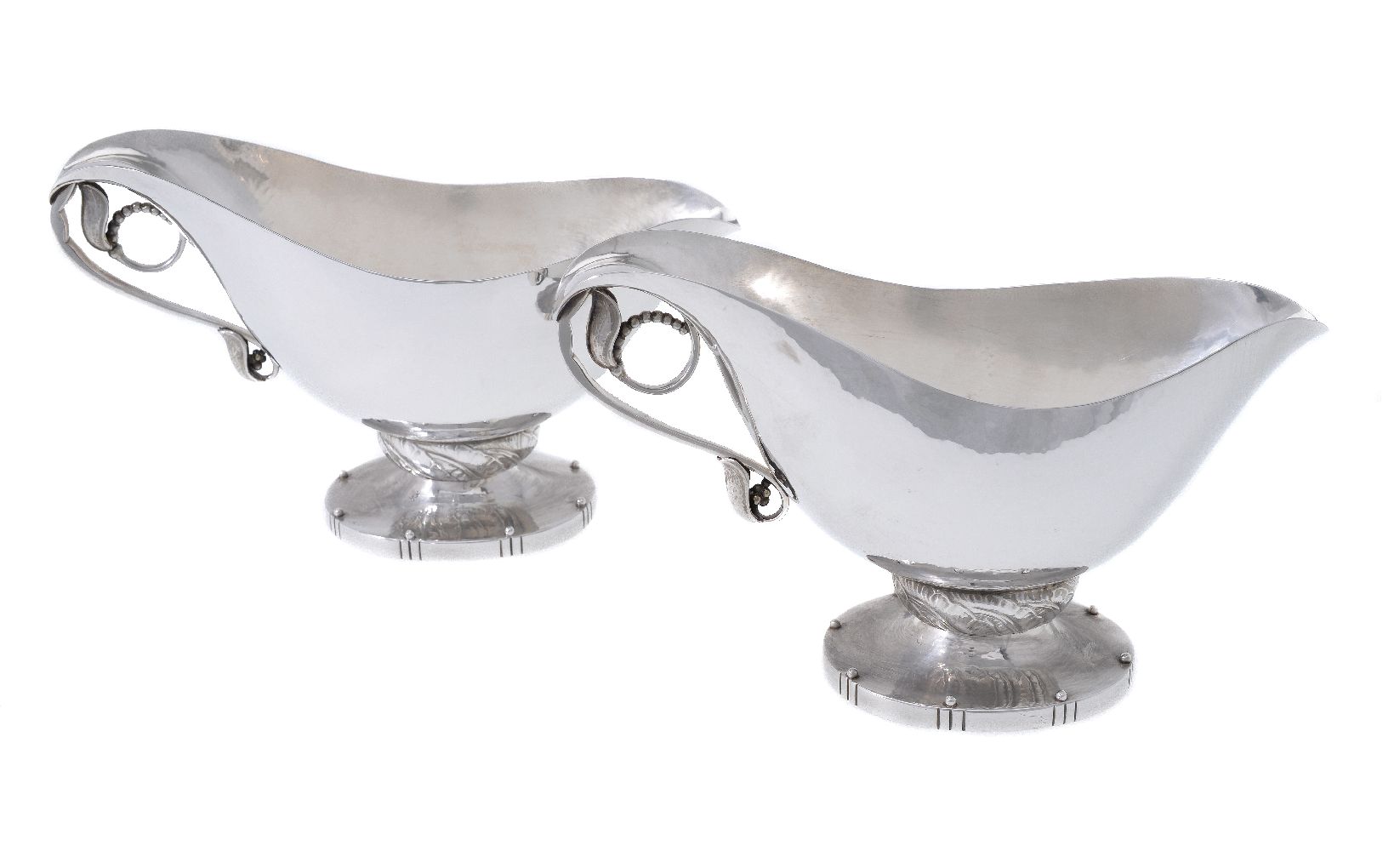 Georg Jensen, a pair of Danish silver Blossom pattern sauce or gravy boats