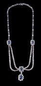 A sapphire and diamond swag necklace