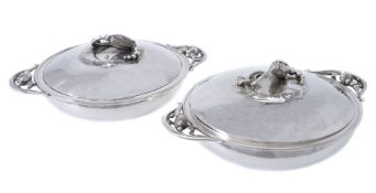 Georg Jensen, a pair of Danish silver Blossom pattern circular vegetable dishes