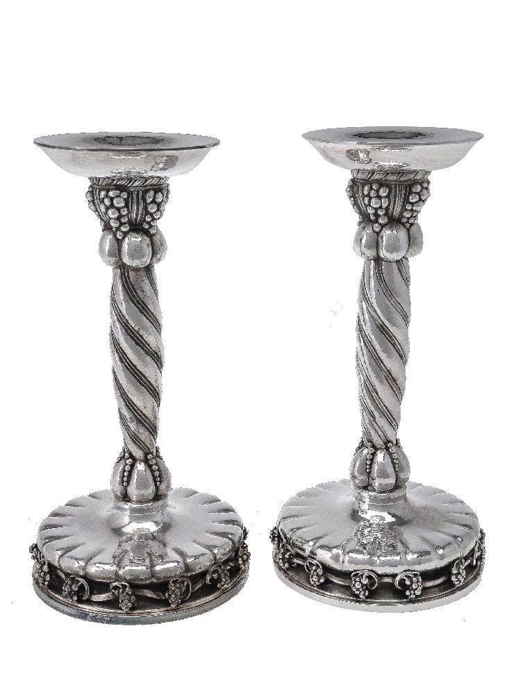 Georg Jensen, a pair of Danish silver Grape pattern large candlesticks