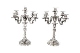 A pair of Italian silver five light candelabra