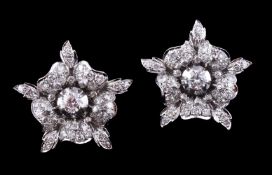 A pair of diamond flower head earrings