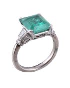 An emerald and diamond ring