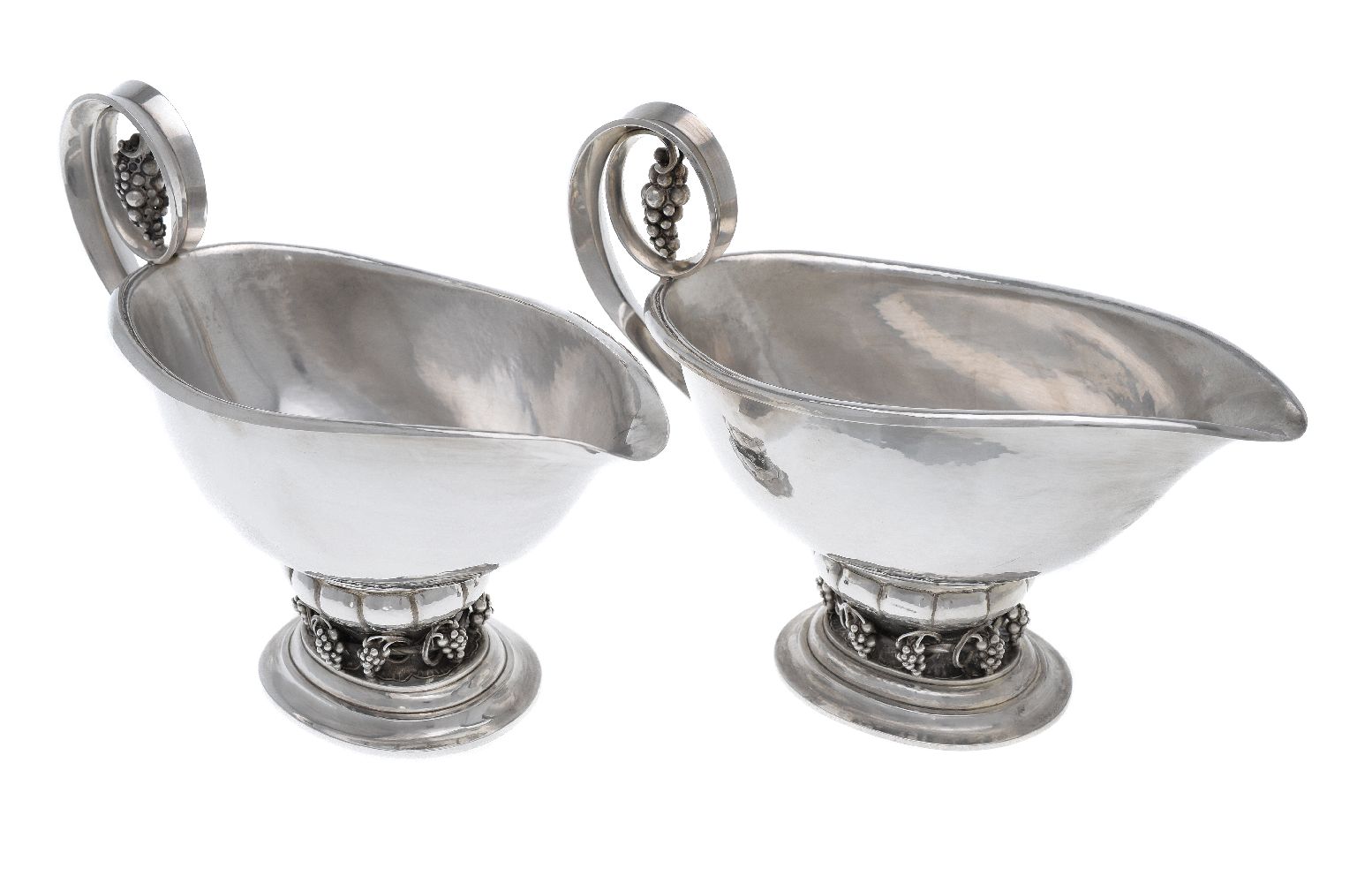 Georg Jensen, a pair of Danish silver Grape pattern sauce or gravy boats