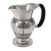 ϒ Georg Jensen, a Danish silver water jug or pitcher