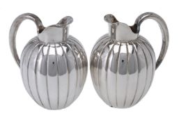 Georg Jensen, a pair of Danish silver Bernadotte cream jugs or pitchers