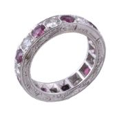 An 18 carat gold ruby and diamond eternity ring