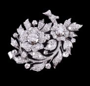 A diamond floral spray brooch pendant