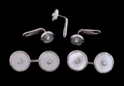 ϒ A pair of mother of pearl and diamond cufflinks and three dress studs retailed by Theo Fennell