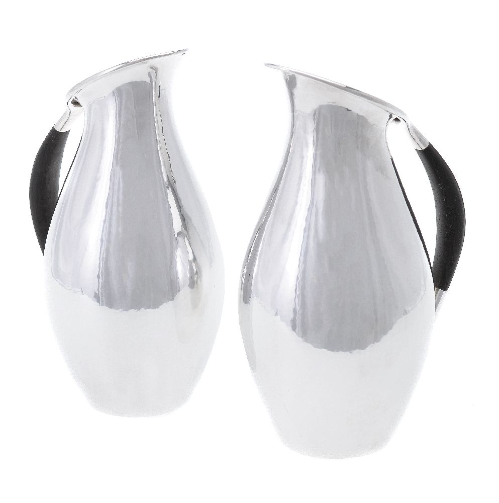 ϒ Georg Jensen, a pair of Danish silver water jugs or pitchers