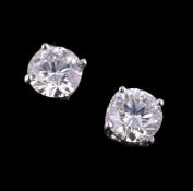 A pair of diamond single stone earstuds