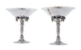 Georg Jensen, a pair of Danish silver Grape pattern pedestal bowls