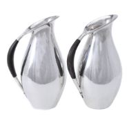 ϒ Georg Jensen, a pair of Danish silver water jugs or pitchers