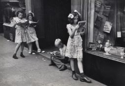 Ruth Orkin (American 1921-1985)Comic book readers, Greenwich Village, NYC