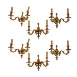 Six French gilt bronze twin light wall appliques in Régence taste