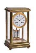 A brass and glazed four-glass mantel clock