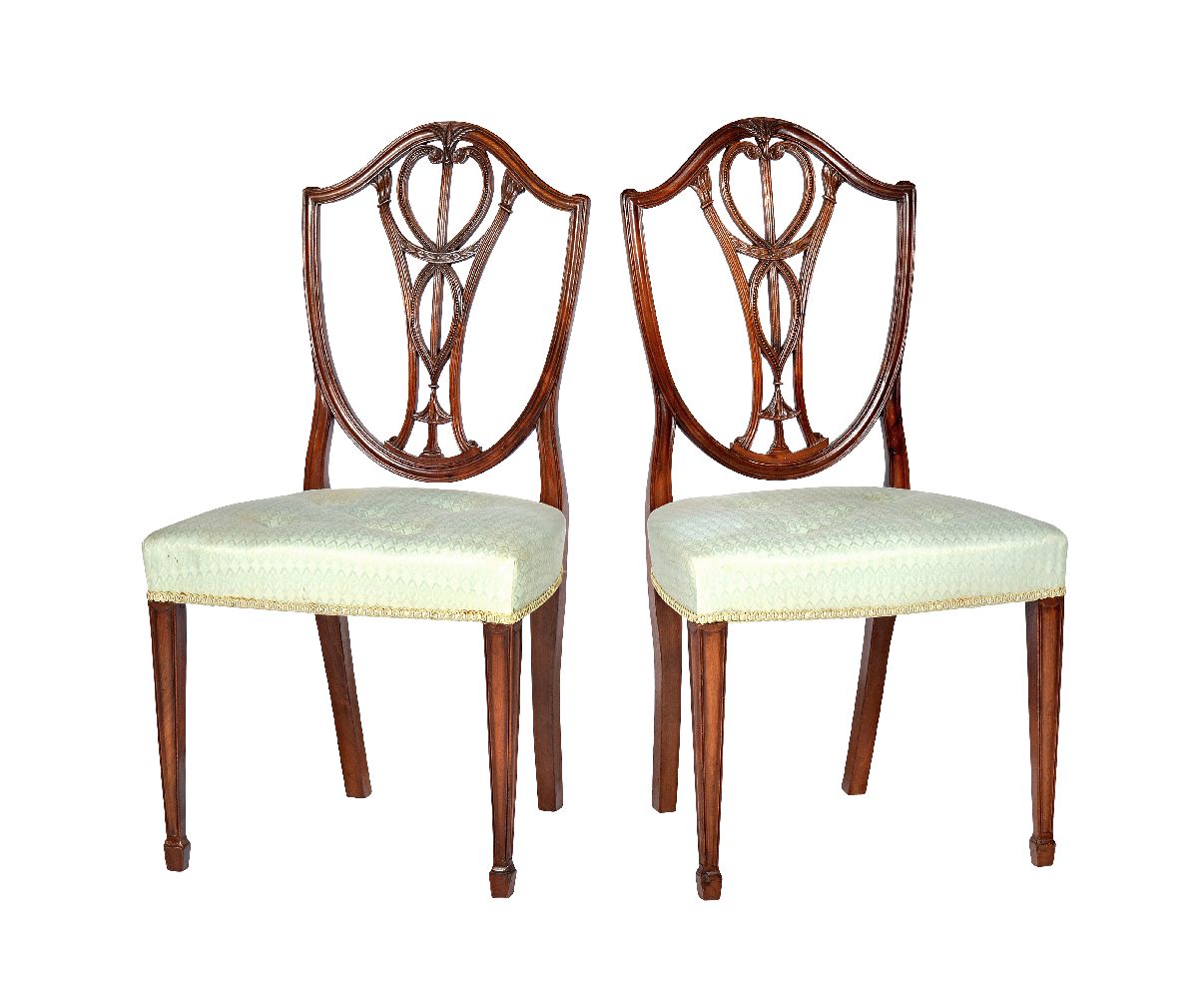 A set of eight mahogany shield back dining chairs in George III style
