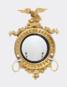 A George III giltwood and gesso girandole convex wall mirror