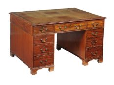 A mahogany twin pedestal desk in George III style