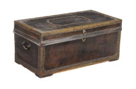 A Chinese leather and brass mounted camphorwood trunk