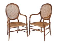 A pair of French stained beech bedroom chairs