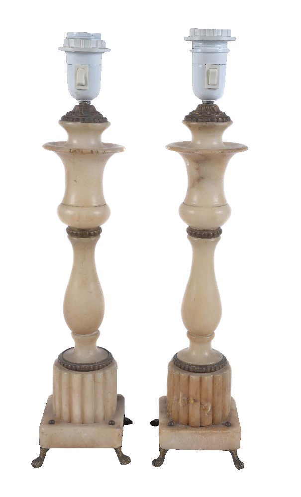A pair of gilt metal mounted alabaster table lamps