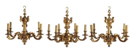 Three gilt bronze six light chandeliers in Régence taste