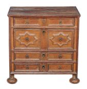 A Charles II oak chest of drawers