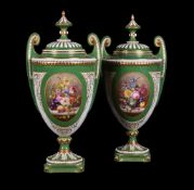 Two similar Royal Worcester green-ground and gilt urns and cover signed by W.A.Hawkins