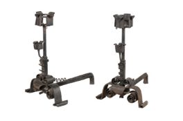 A pair of substantial cast and wrought iron andirons in Arts and Crafts style