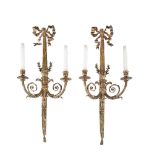 A pair of gilt metal twin light wall appliques in Louis XVI taste