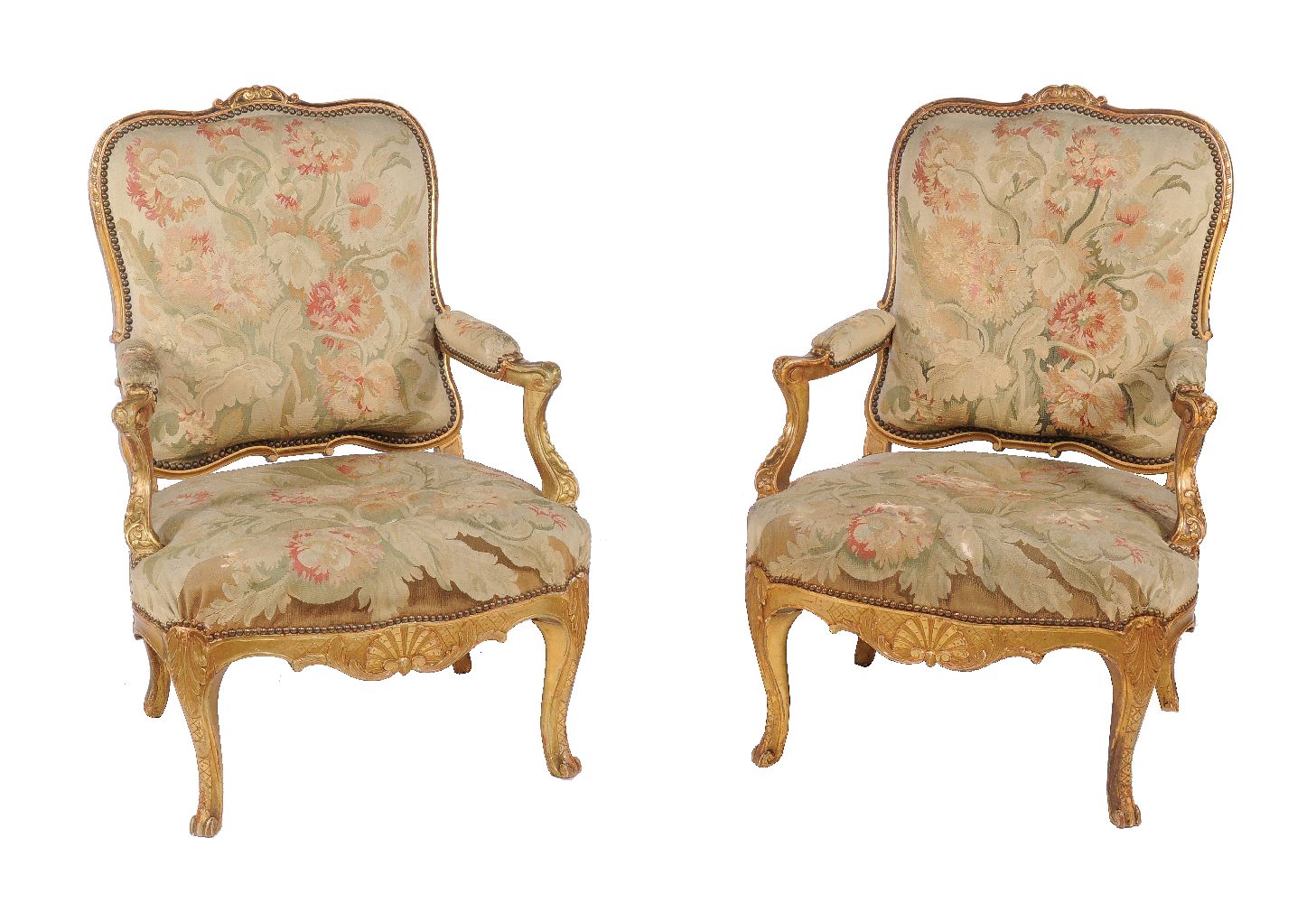 A pair of carved giltwood and tapestry upholstered armchairs