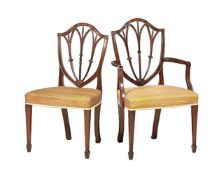 A set of twelve mahogany dining chairs in George III style
