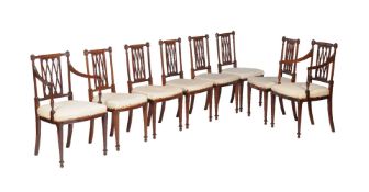 A set of eight mahogany and inlaid dining chairs