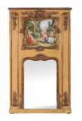 A carved giltwood and painted trumeau mirror