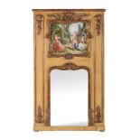 A carved giltwood and painted trumeau mirror