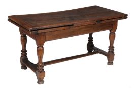 An oak drawer leaf refectory table
