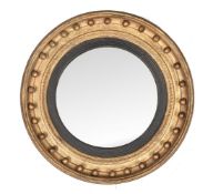 A Regency giltwood and composition convex wall mirror