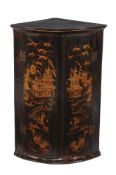 A George III Japanned and gilt decorated hanging corner cupboard
