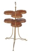 An Edwardian mahogany and gilt brass two tier dumb waiter