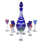 A Czechoslovakian clear cut glass and blue flashed spirit set and five other assorted spirit glasses
