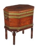 A mahogany and brass bound wine cooler on stand