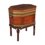 A mahogany and brass bound wine cooler on stand