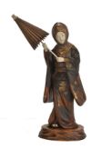 ϒ A Japanese Lacquered Wood and Ivory Figure of a Bijin